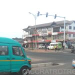 Blue Mercedes trotro bus approaches palm win junction from Wireless, Labadi