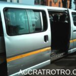 Trotro bus door opened in anticipation of passengers at Accra Central