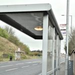 Bus stop bus along a road