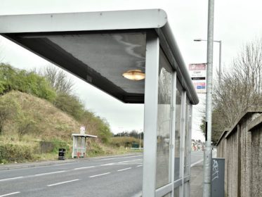 Bus stop bus along a road