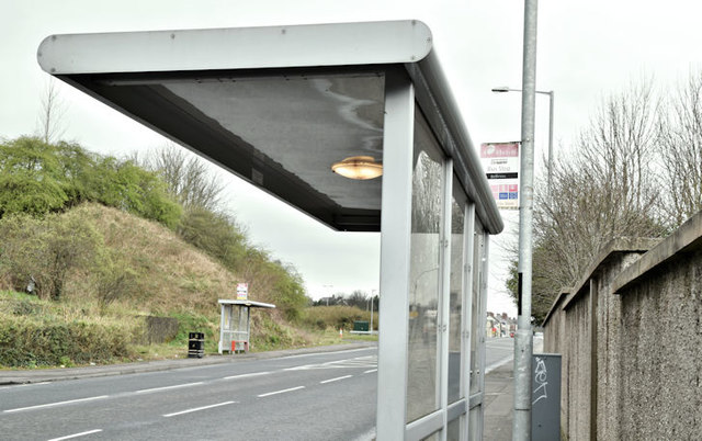 Bus stop bus along a road