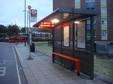 BUS STOP AT NIGHT IN THE CITY