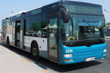 Bus parked at street curb