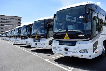 a line up of Quincy buses