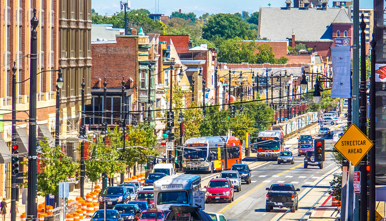 city buses on busy streets