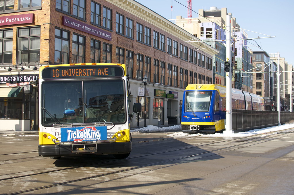 Sangamon mass transit bus near a building 