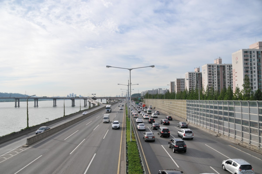 cars move along a street