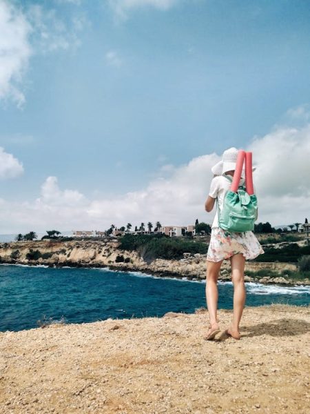 a tourist explores the beach