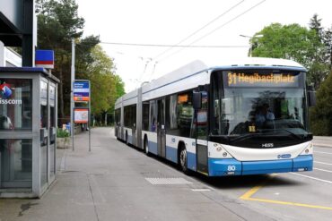 a bus exits a station in zurich