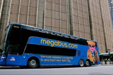 a mega bus about to take off
