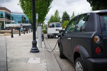 an ev charges at a station