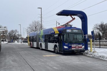 electric bus at a charging station in Minnesota