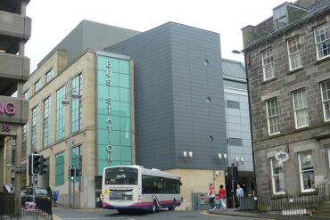 A coach enters the Edinburgh bus station