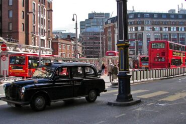 a taxi passes by the Victoria bus station