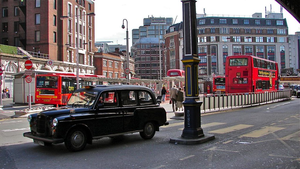 a taxi passes by the Victoria bus station