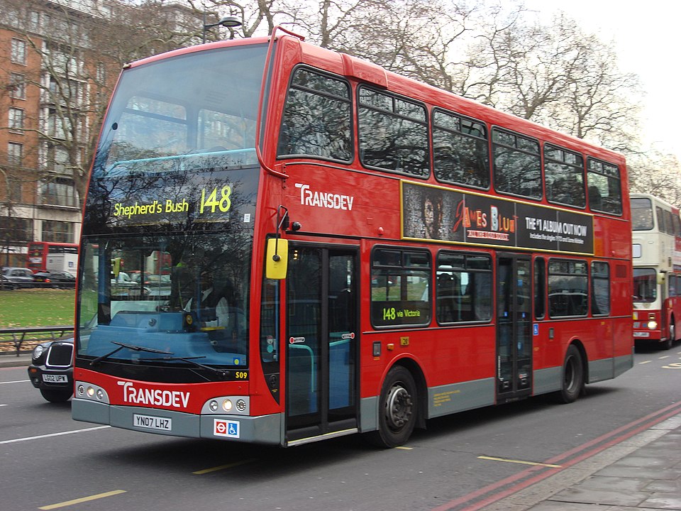 A London bus travels along its route
