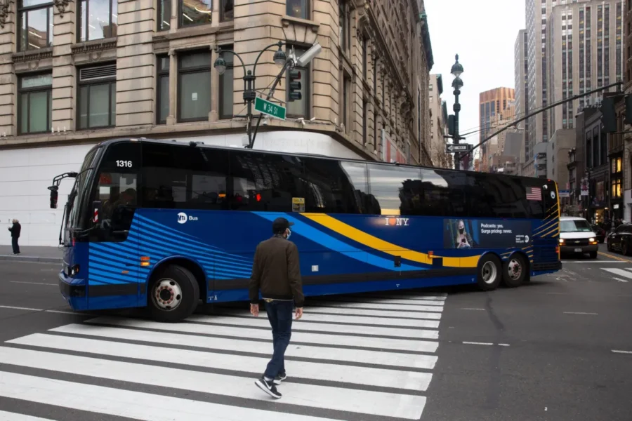 A Manhattan Express bus approaches a stop