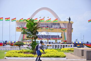 A man skates across an adorned Independence square in Accra