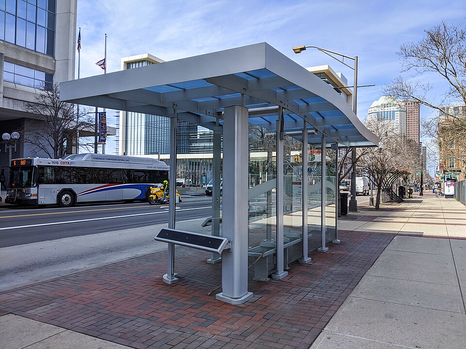 An upscale bus stop in the city
