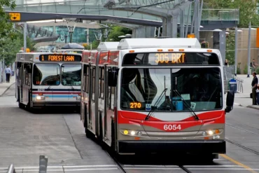 Buses arrive at a station (1)
