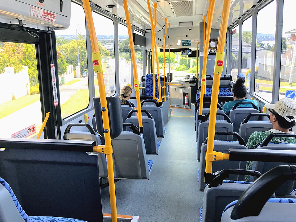 Passengers take their seats on a public transit bus