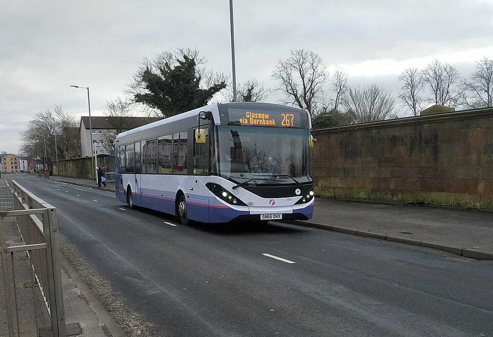 A Glasgow bus approaches the city