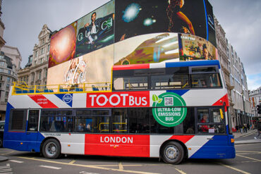A London bus passes by a advertising display