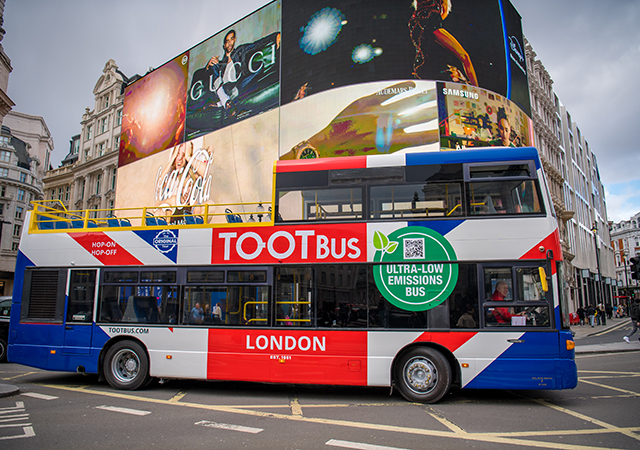 A London bus passes by a advertising display