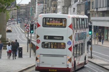 A Lothian bus on the 671 Dennis Trident Street