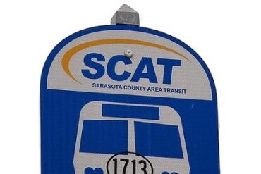 A SCAT bus sig along a road