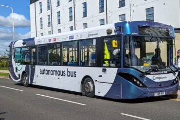 A bus arrives at a stop in Edinburgh