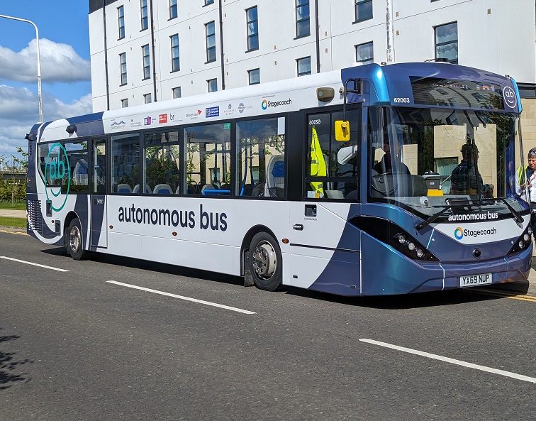 A bus arrives at a stop in Edinburgh