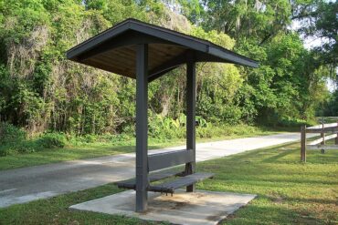 A bus bench under a shed