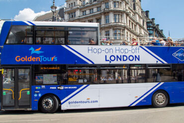 A bus cruises on a London street