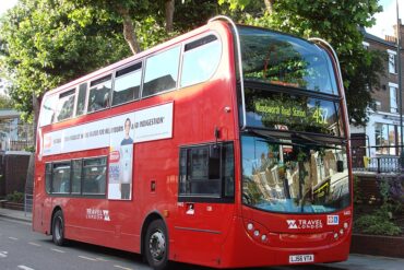 A bus in London begins arrives at a stop