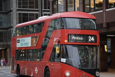 A bus stops on a street in London