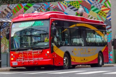A circulator bus pars at a stop