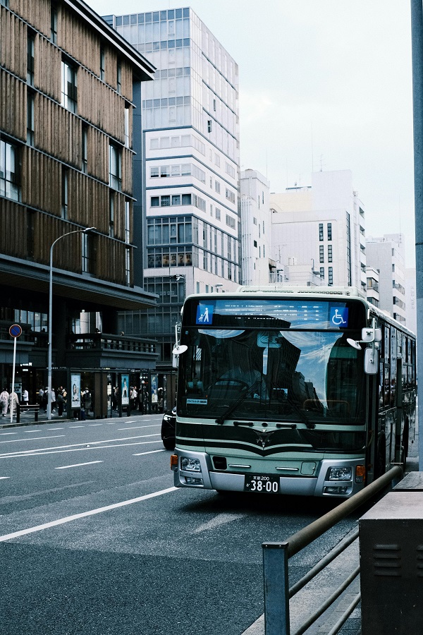 A city bus stops on its journey