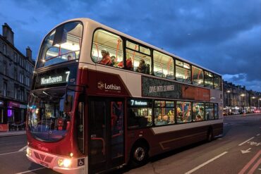 An Edinburgh night bus leaves a stop