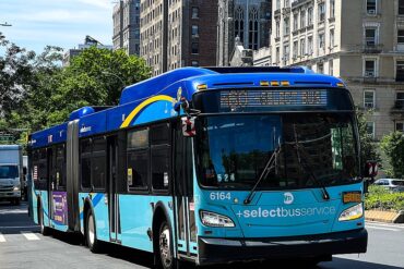 An MTA bus approaches a stop in New York City