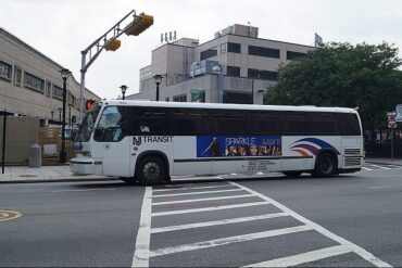 An RTS bus arrives at a stop