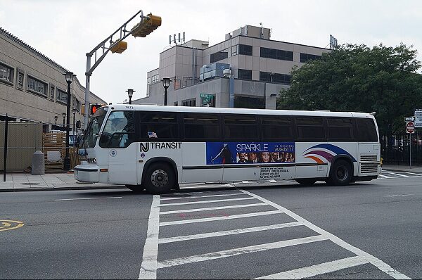 An RTS bus arrives at a stop