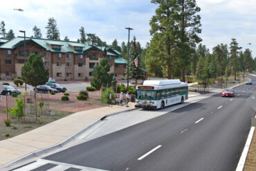 Shuttle Bus 0662 stops at a residence near the Grand Canton route
