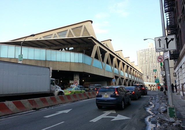 Vehicles approach a Manhattan bus station