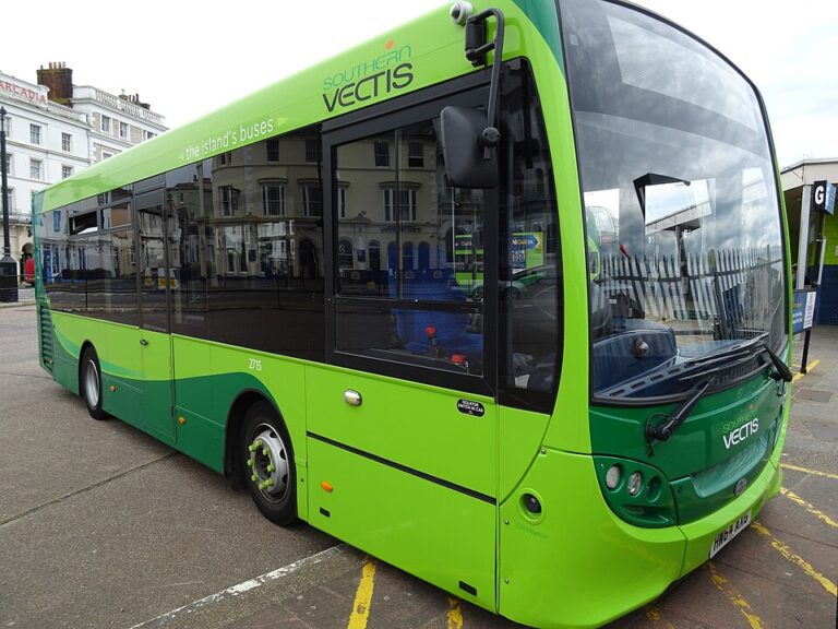 A green bus parks in New YOrk bus stop