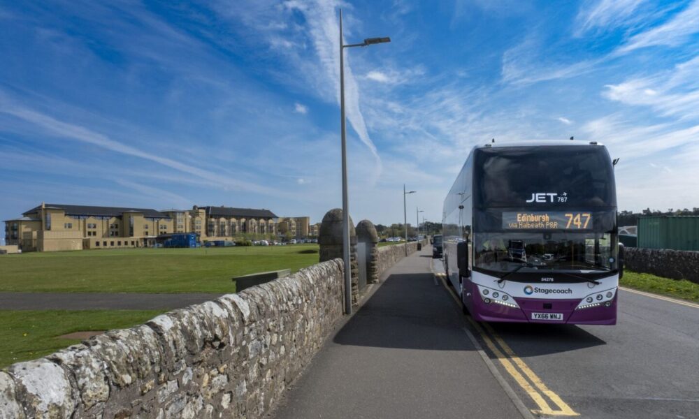 A bus travels away from St Andrews in Scotland