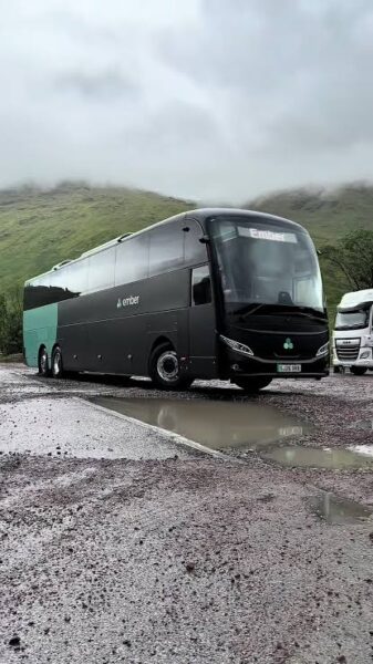 An Ember electric bus on a hill