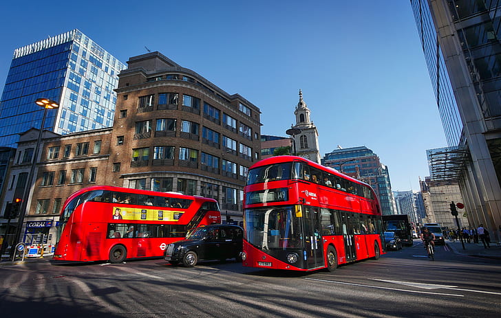 Buses traverse the city square in London