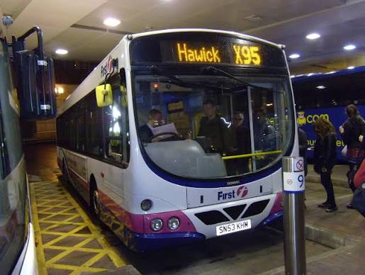Passengers board a FirstBus service coach